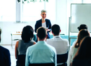 Businesswoman leading a training class for professionals